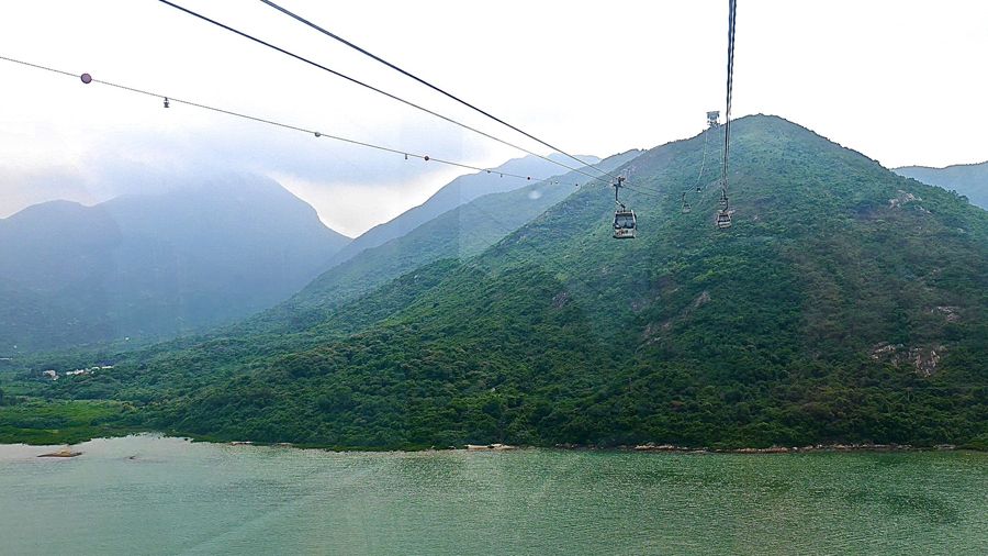 Ascending into the mist on a voyage to The Big Buddha via cable car