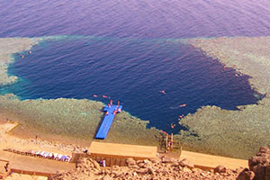 Blue Hole is a diving location on east Sinai, a few kilometres north of Dahab, on the coast of the Red Sea. The Blue Hole is a submarine sinkhole, around 130 m deep.